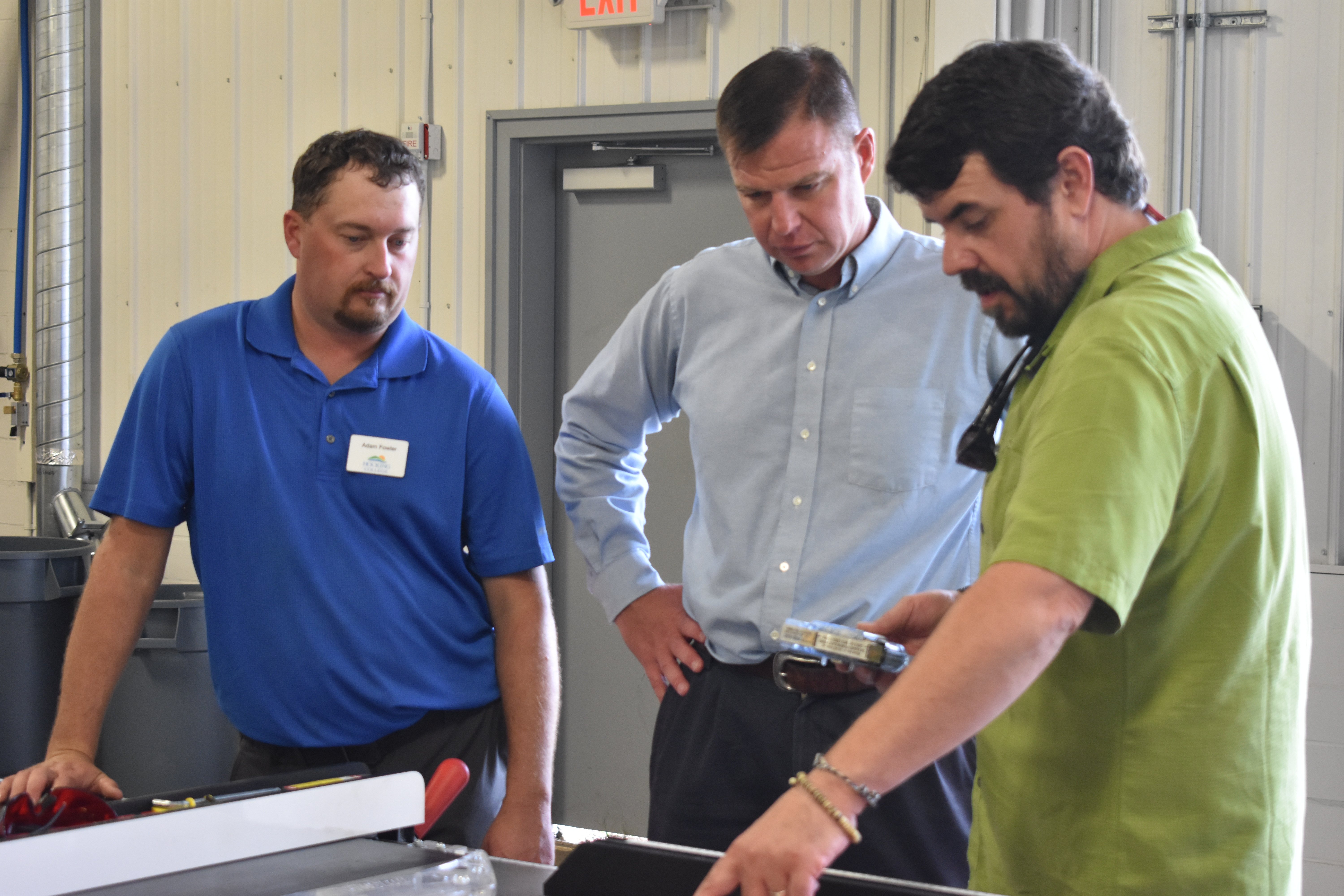 Faculty and staff look at tools at the new Hocking Makers Network Wood Shop | Hocking Makers Network Celebrates Grand Opening Of Wood Shop