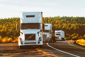 white-volvo-semi-truck-on-side-of-road-2199293