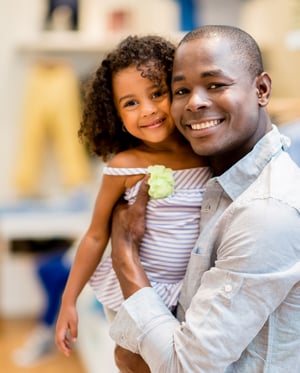 Beautiful portrait of a father and daughter shopping for clothes